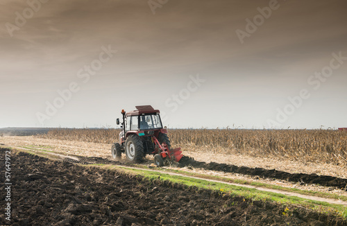 Tractor plowing field