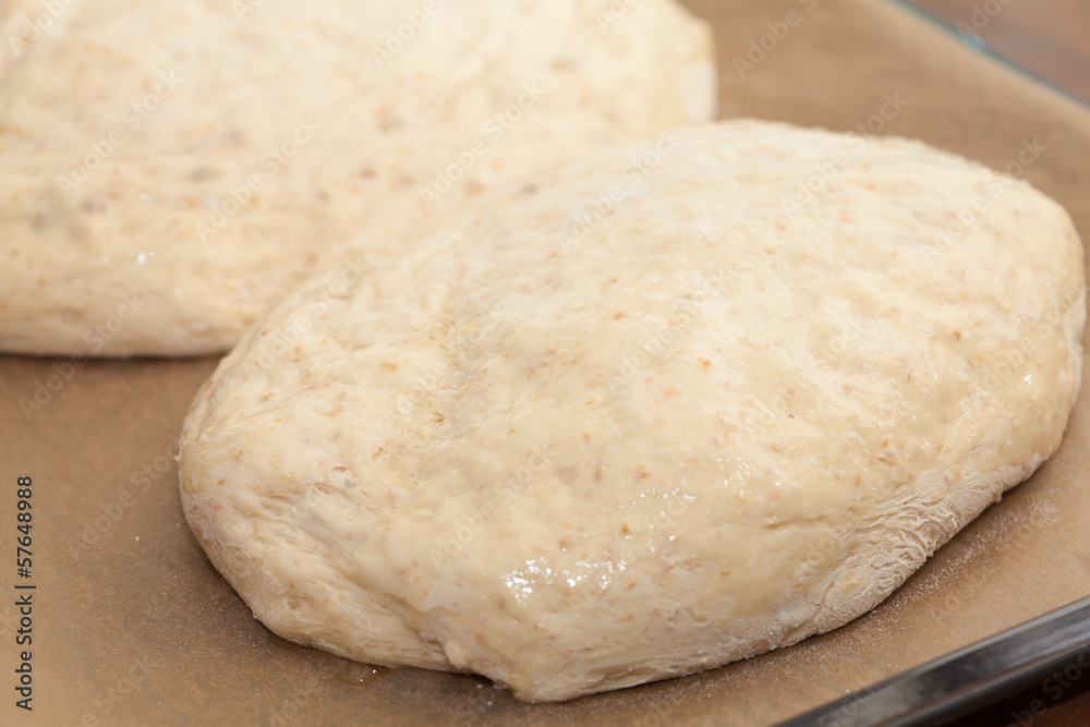 bread making - two formed loaves of raw dough bread making - two formed loaves of raw dough