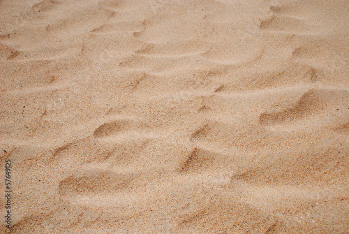 Sand background of the windy coast