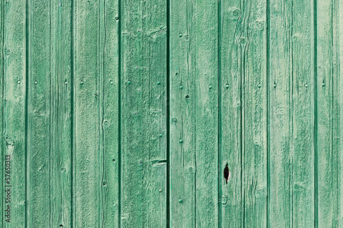 Old green painted weathered wooden planks