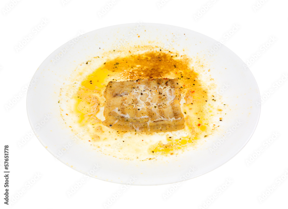 Overdone microwaved haddock on a white dish Overdone microwaved haddock on a white dish