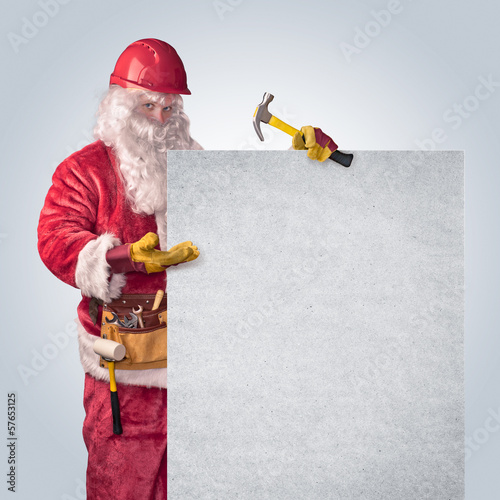 Santa Claus worker in helmet with poster