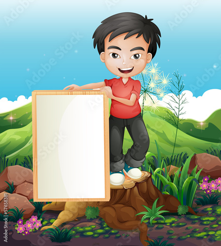 A man standing above the stump holding an empty signboard