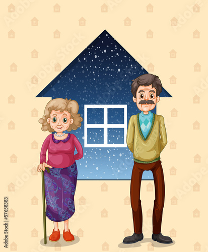 Grandparents in front of the small house