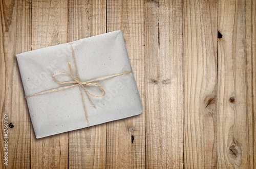 Package on old wooden background