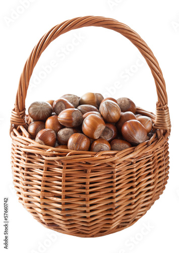 hazelnuts in basket isolated