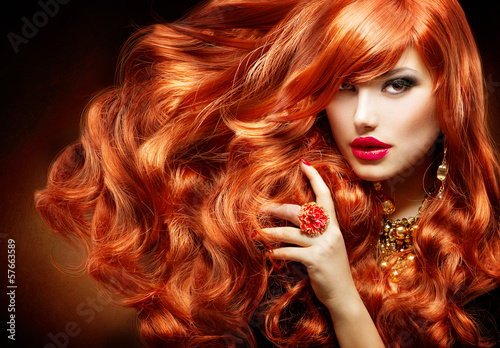 Fotografie Long Curly Red Hair. Fashion Woman Portrait