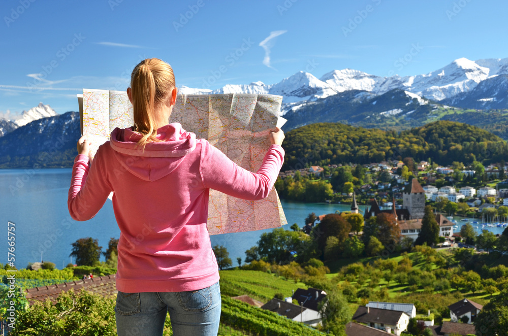 Girl looking to the map. Switzerland