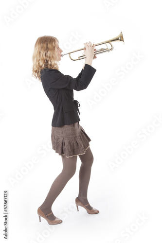 young pretty woman playing the trumpet