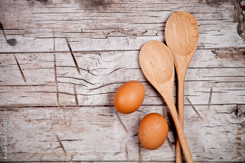 spoons and brown eggs photo