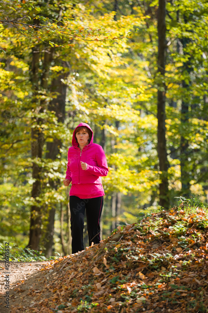 woman running in the forest woman running in the forest