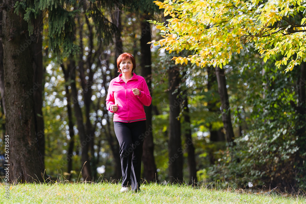 woman running in the forest woman running in the forest