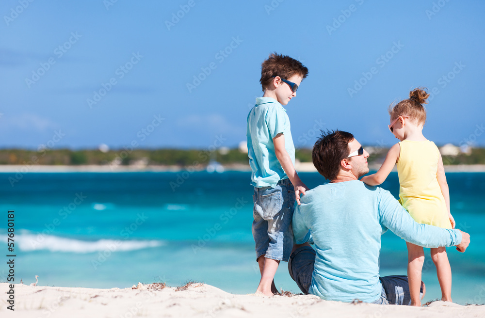 Father and kids at beach