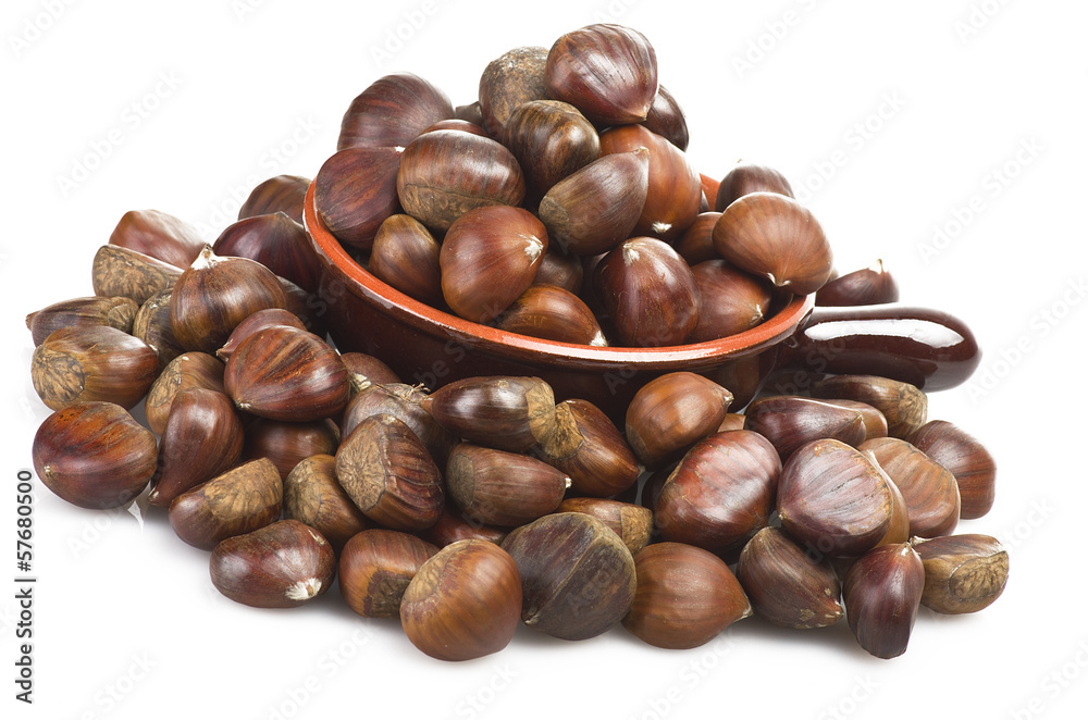 Bowl with chestnuts close up on the white