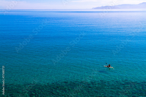 Canoeing on the crystal-clear turquoise waters.