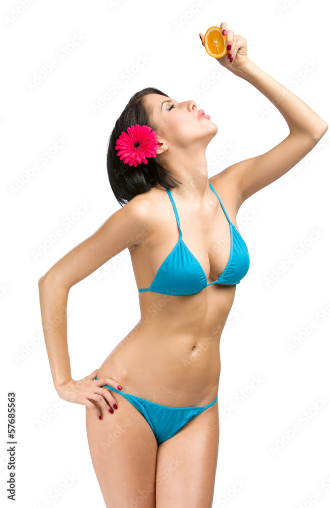 Portrait of woman wearing bikini who keeps cut of orange Portrait of woman wearing bikini who keeps cut of orange