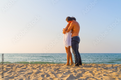 Young couple love play at the beach