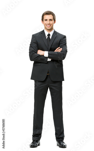 Full-length portrait of business man with hands crossed