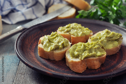 canapes of bread and guacamole