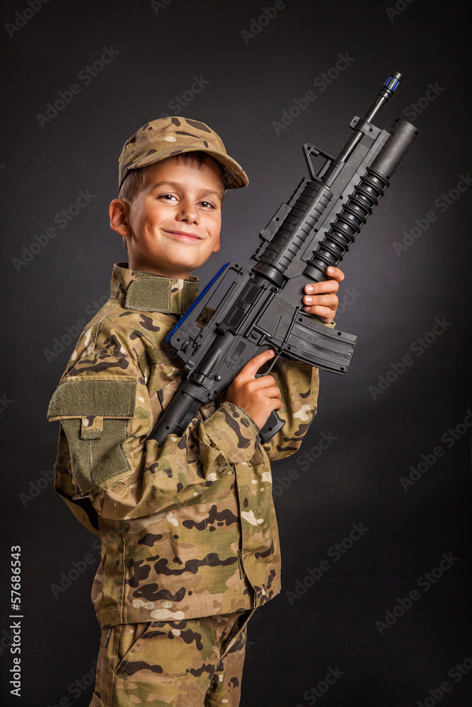 Young soldier with rifle Young soldier with rifle