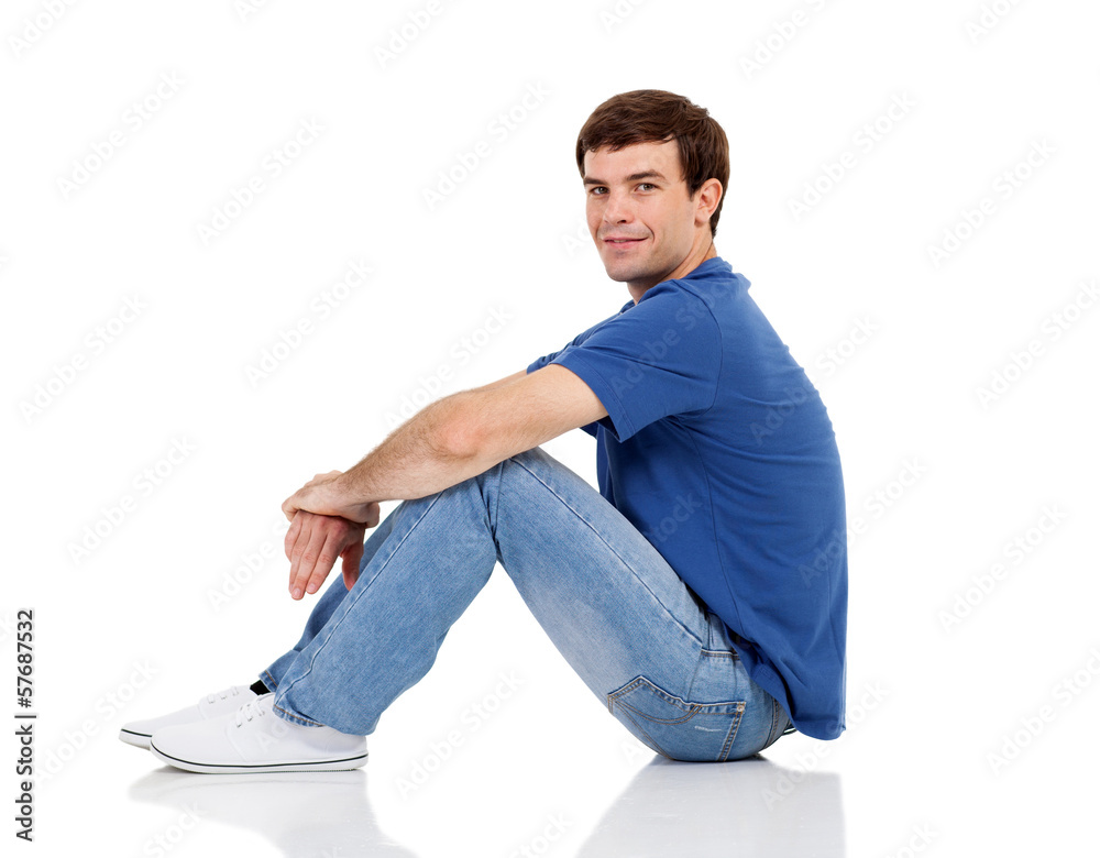 side view of man sitting on the floor side view of man sitting on the floor