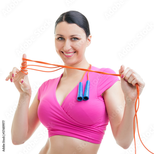 Happy woman working out in the gym with a rope.