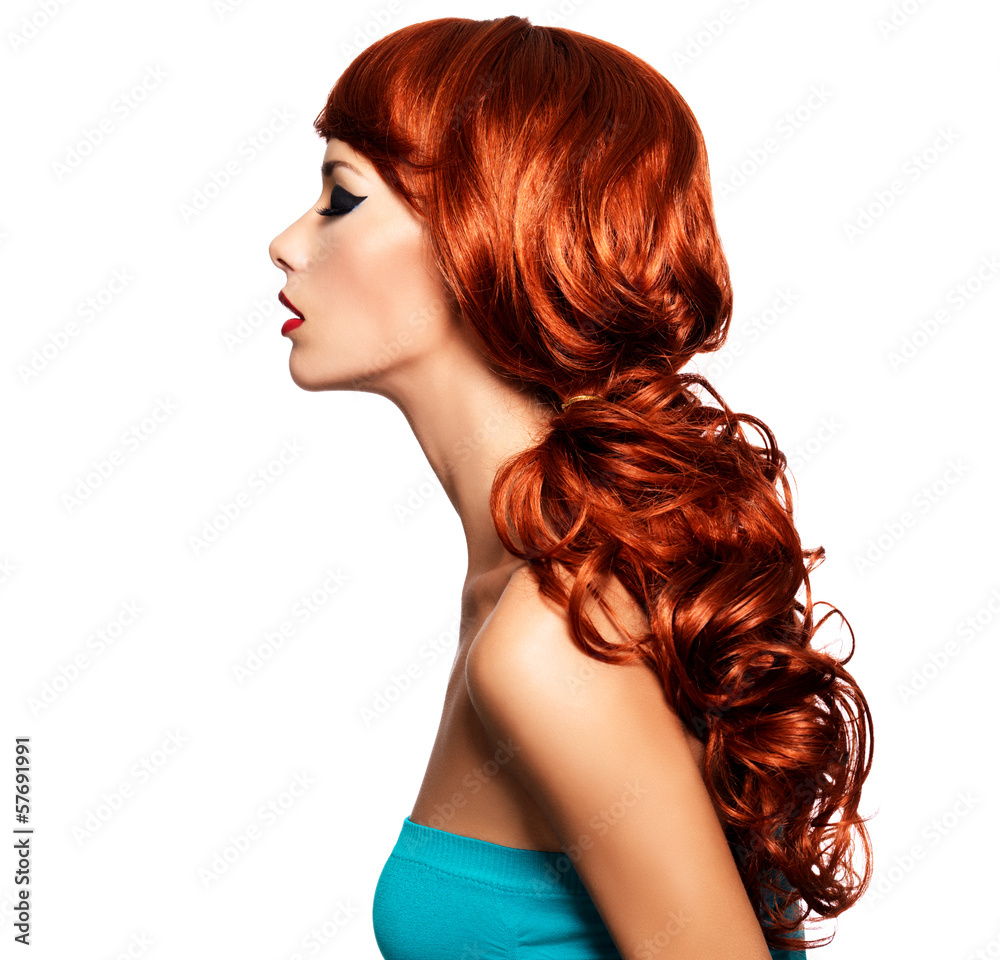 Profile portrait of a woman with long red hairs. Profile portrait of a woman with long red hairs.