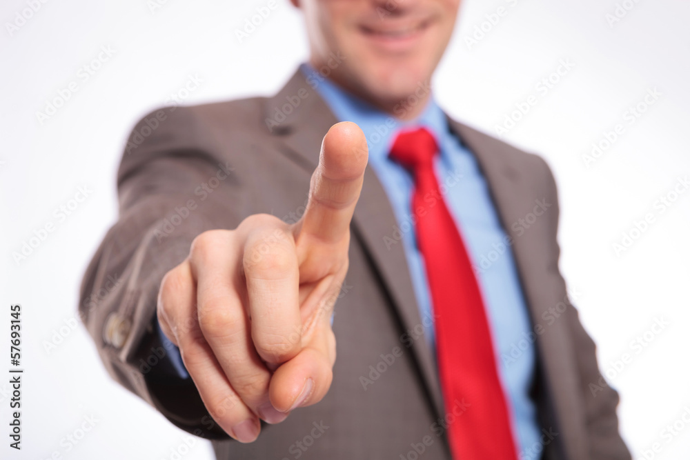 young business man pushing imaginary button young business man pushing imaginary button