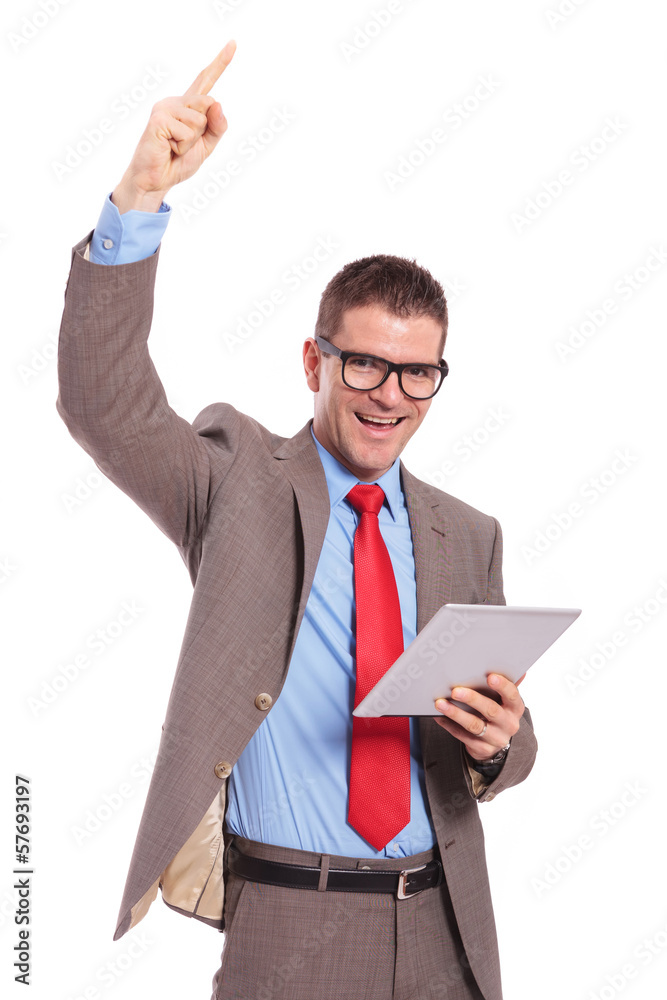 young business man holds tablet and cheers with finger up young business man holds tablet and cheers with finger up