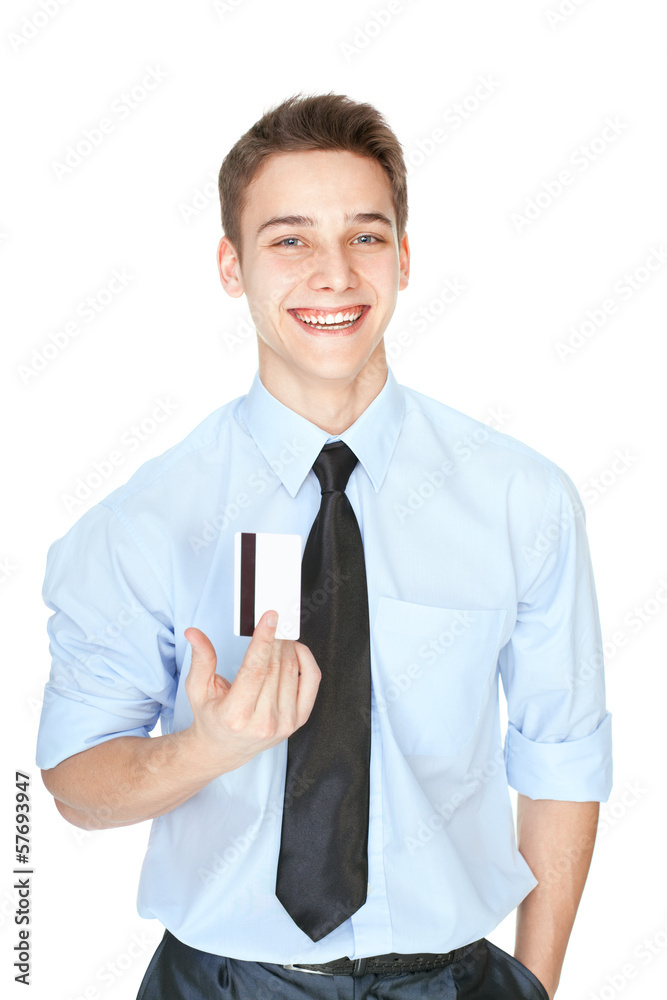 Young laughing man holding a credit card isolated on white Young laughing man holding a credit card isolated on white