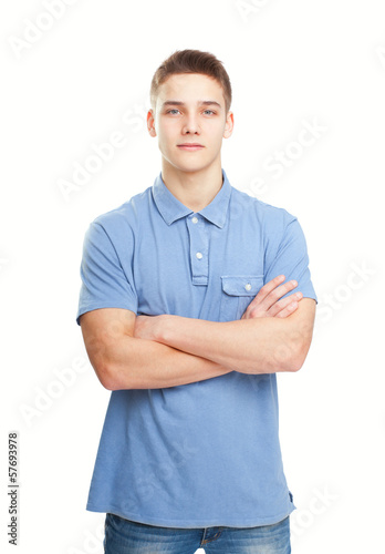 smiling man standing with hands folded against isolated on white