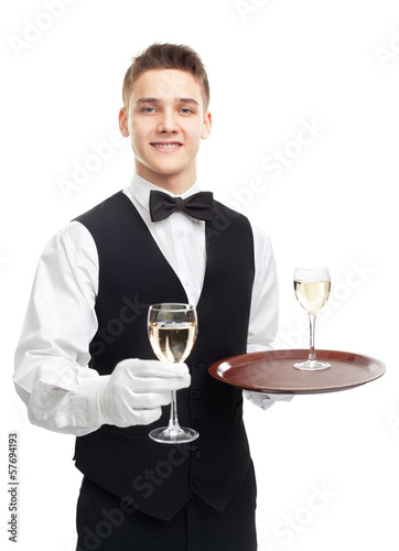 Young smiling waiter holding glasses of wine