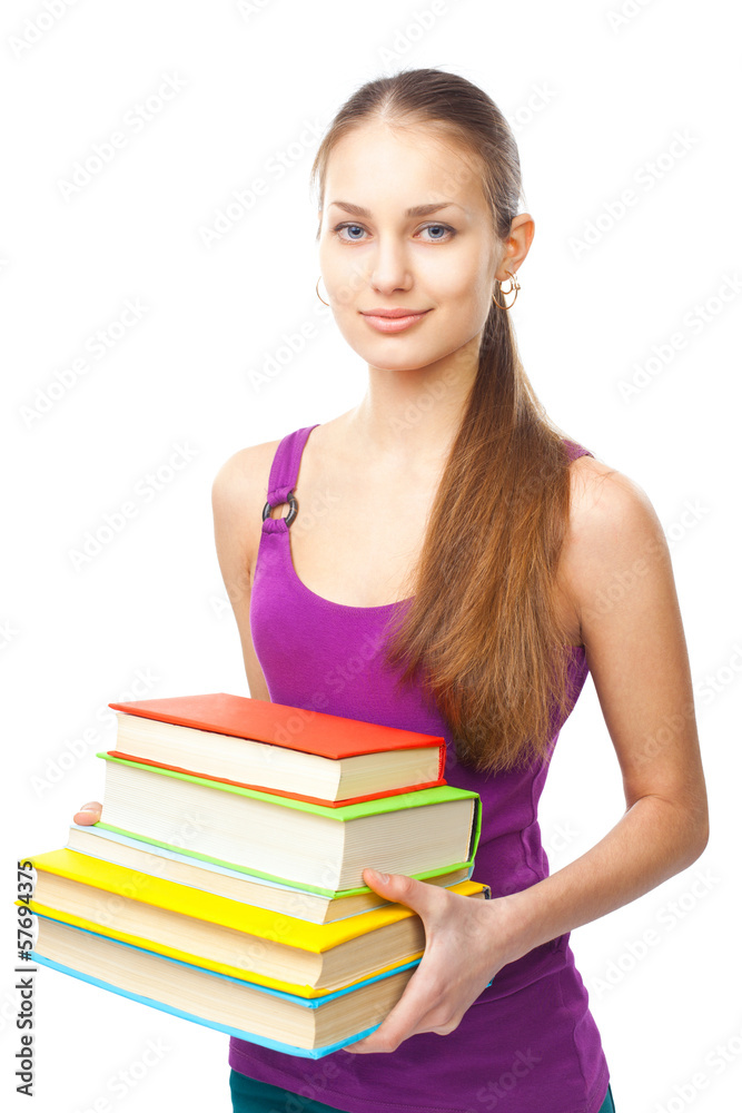 Smiling student girl holding stack of books Smiling student girl holding stack of books