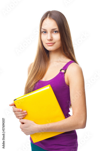 young student girl holding yellow book
