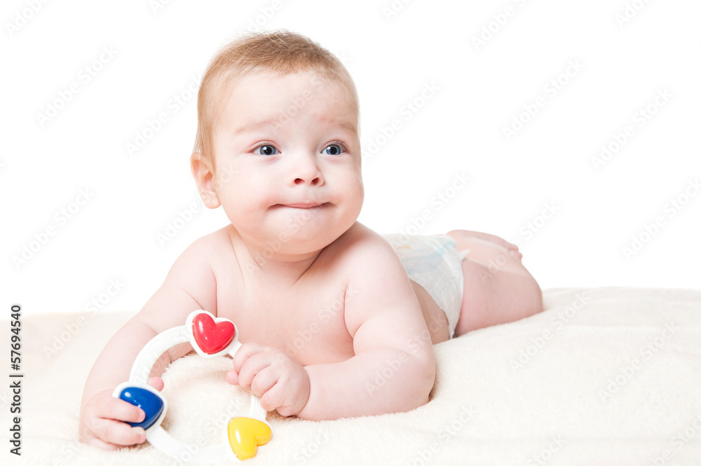 Baby playing with a rattle, isolated on white Baby playing with a rattle, isolated on white