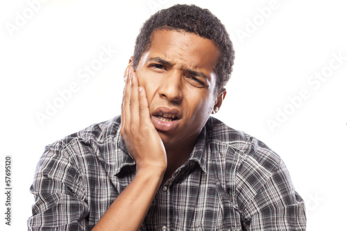 young African American young man with a strong toothache