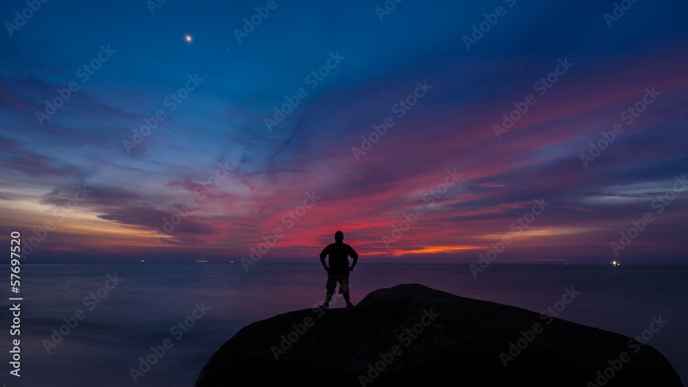 Silhouette of man at sunset in holiday concept