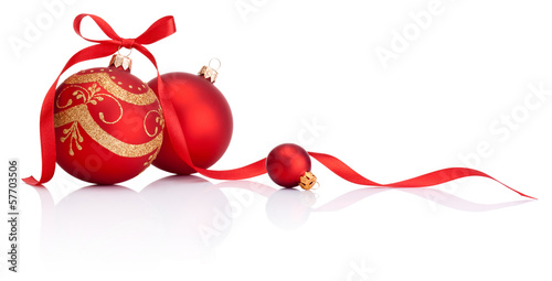 Red christmas decoration balls with ribbon bow isolated on white