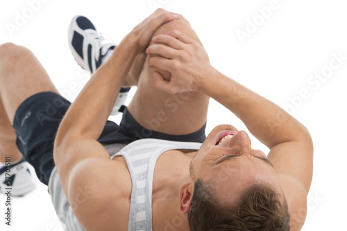 Man feeling pain in his knee.