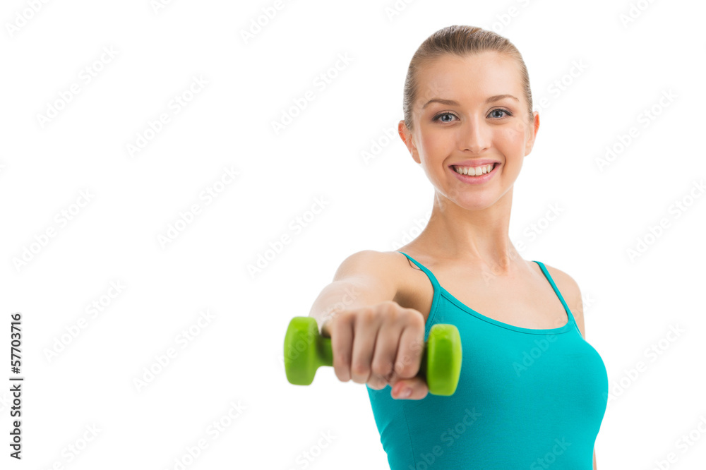 Nice smiling woman exercising with dumbbells. Nice smiling woman exercising with dumbbells.