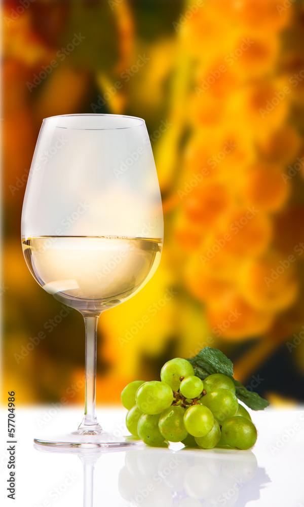 wineglass with white wine and grape wineglass with white wine and grape