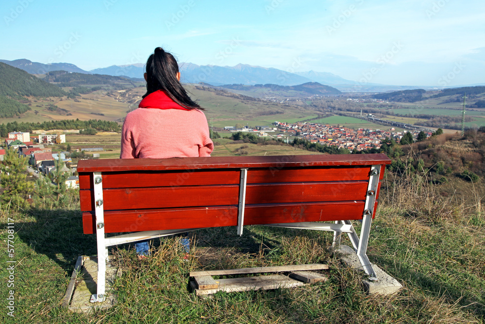 Lonely girl at bench & High Tatras mountains Lonely girl at bench & High Tatras mountains
