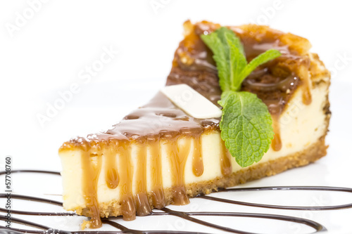piece of cheese cake decorated with mint leaves