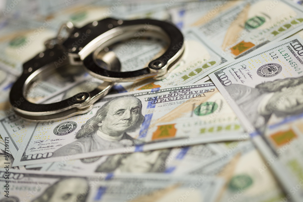 Handcuffs and Newly Designed One Hundred Dollar Bills Handcuffs and Newly Designed One Hundred Dollar Bills