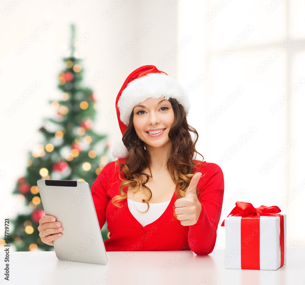 woman with gift box and tablet pc computer woman with gift box and tablet pc computer