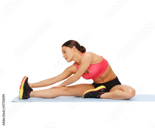 sporty woman doing exercise on the floor © Syda Productions