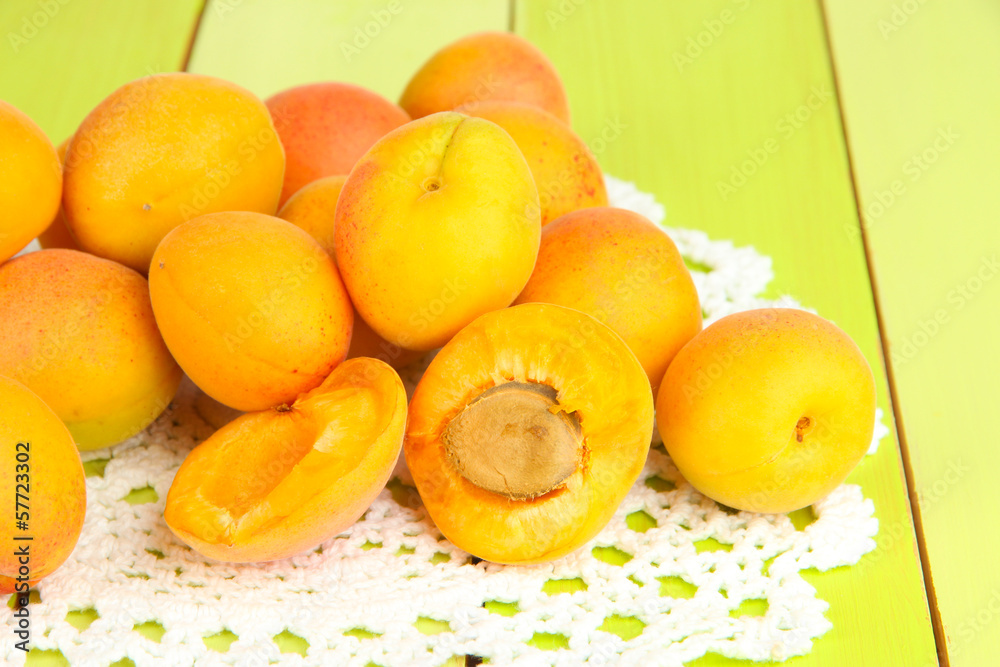 Fresh natural apricot on green wooden table Fresh natural apricot on green wooden table