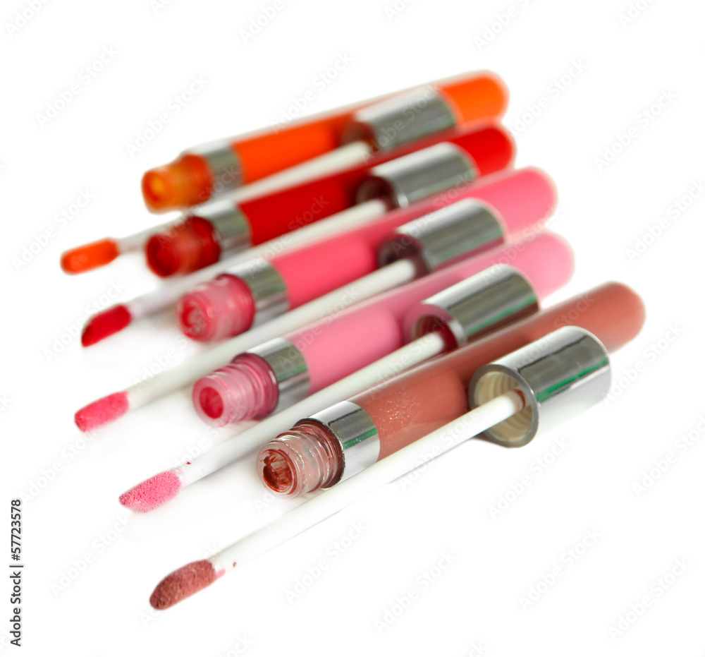 Beautiful lip glosses, isolated on white Beautiful lip glosses, isolated on white