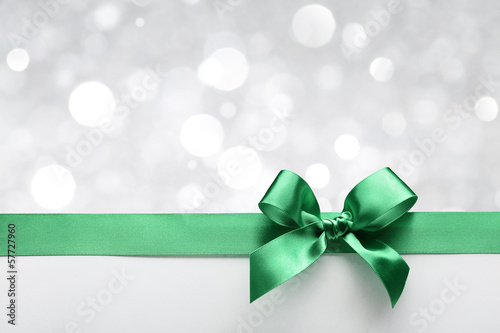 Green ribbon bow with bokeh