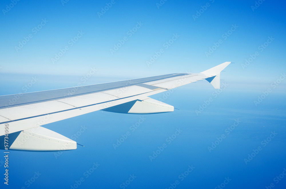 Airplane wing out of window Airplane wing out of window